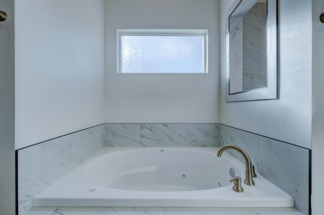 bathroom featuring a tub to relax in