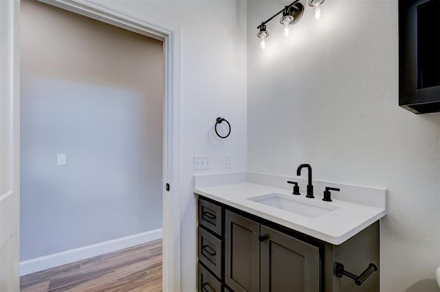 bathroom featuring hardwood / wood-style floors and vanity