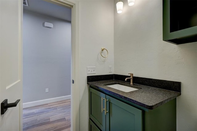 bathroom featuring vanity and hardwood / wood-style flooring