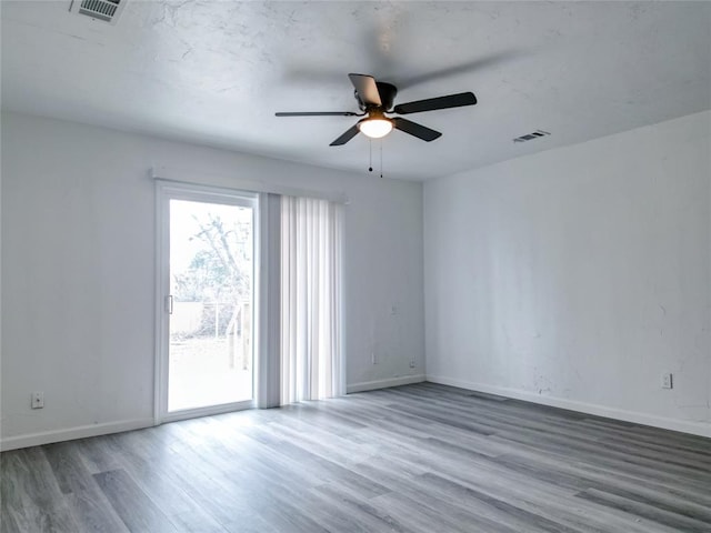 unfurnished room featuring hardwood / wood-style flooring and ceiling fan