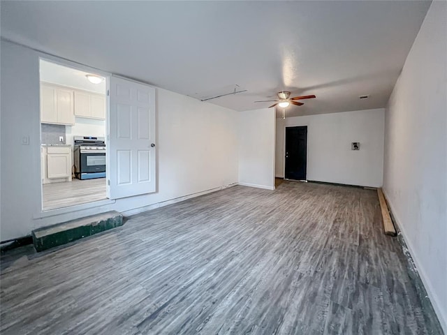 unfurnished living room with hardwood / wood-style floors and ceiling fan