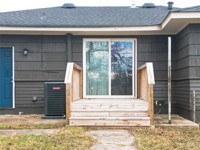 doorway to property with central AC