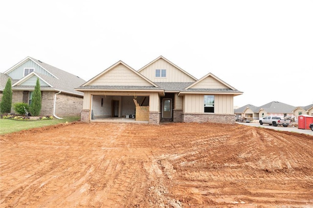 craftsman-style house with a garage and board and batten siding