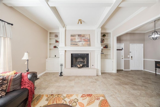 tiled living room featuring crown molding, a brick fireplace, built in shelves, and an inviting chandelier