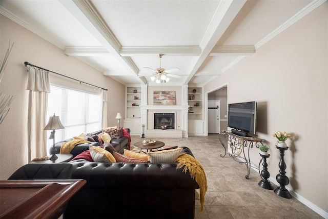 living room with built in shelves, crown molding, a brick fireplace, beamed ceiling, and ceiling fan