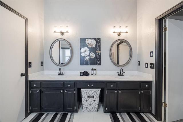 bathroom with double vanity and a sink