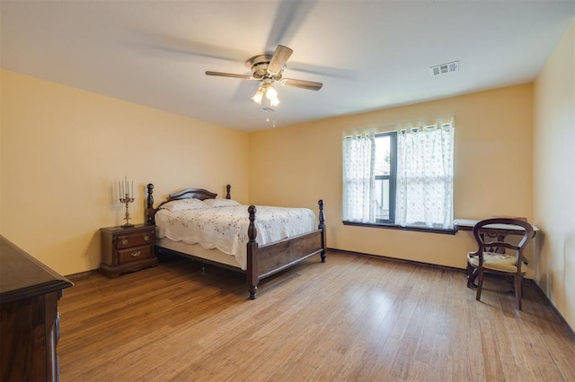 bedroom with ceiling fan and light wood-type flooring