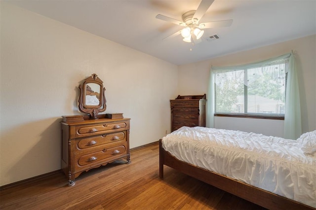 bedroom featuring ceiling fan and light wood-type flooring