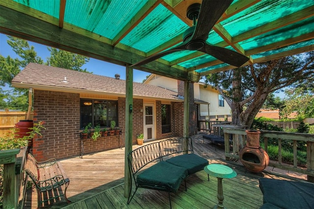 wooden terrace featuring ceiling fan