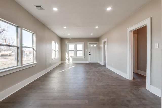 empty room featuring dark hardwood / wood-style flooring