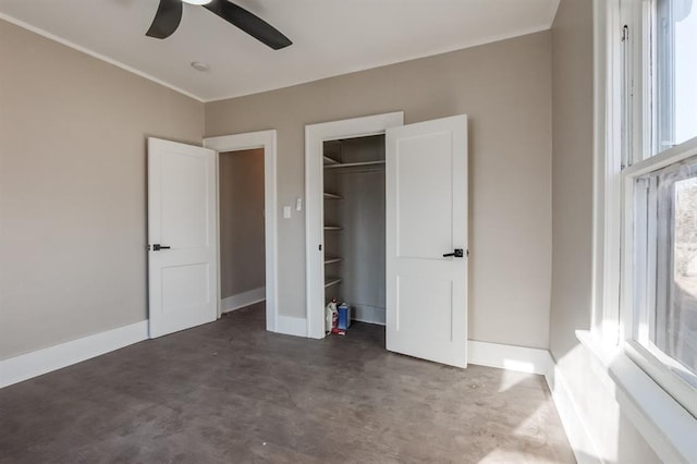 unfurnished bedroom featuring ceiling fan, a closet, and multiple windows