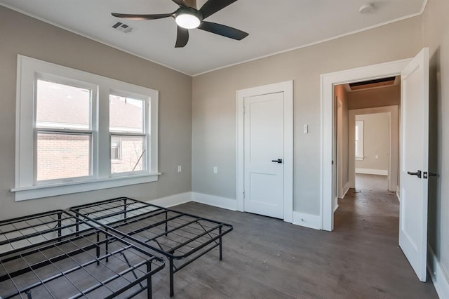 interior space with concrete floors and ceiling fan