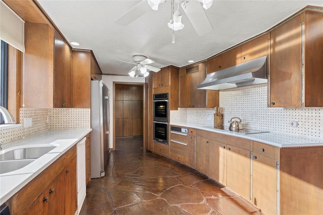 kitchen featuring backsplash, ceiling fan, sink, and stainless steel appliances