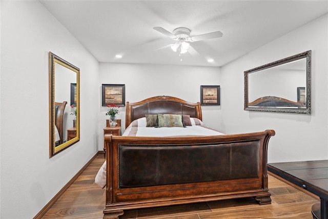 bedroom with ceiling fan and hardwood / wood-style flooring