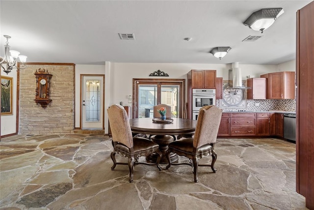 dining space with a notable chandelier