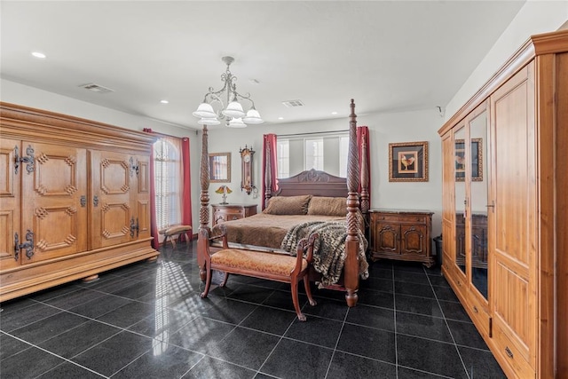 bedroom featuring a notable chandelier