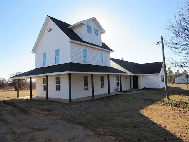 country-style home with covered porch