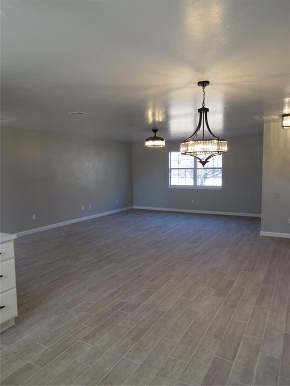 spare room featuring light wood-type flooring