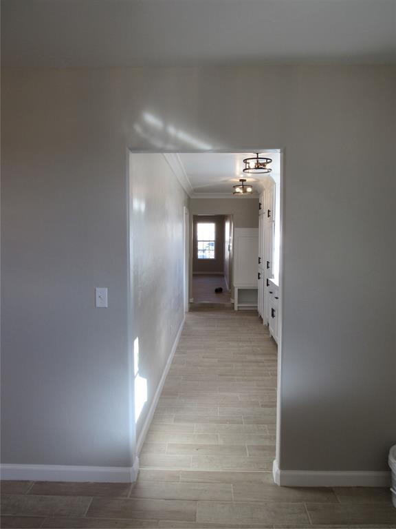 hall with light hardwood / wood-style floors