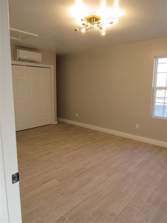 spare room with a wall mounted air conditioner