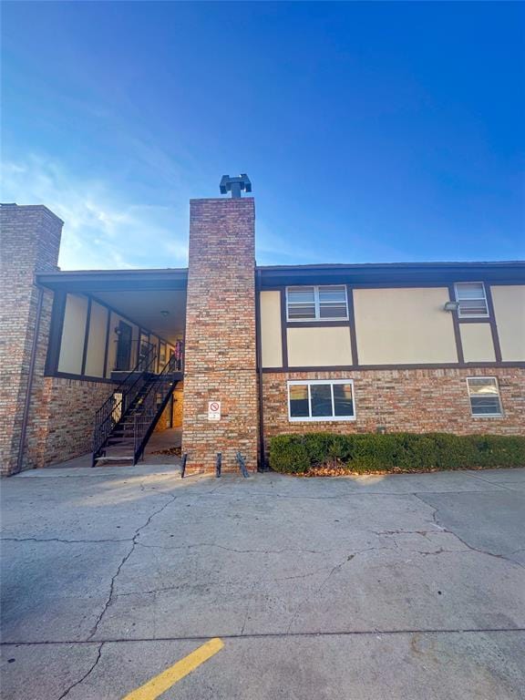 view of side of property with a carport