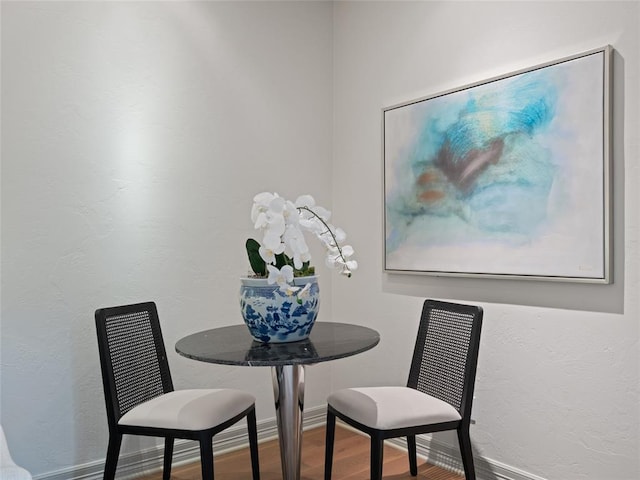 dining room with hardwood / wood-style floors