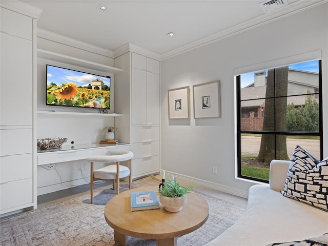 interior space featuring built in desk, a wealth of natural light, and crown molding