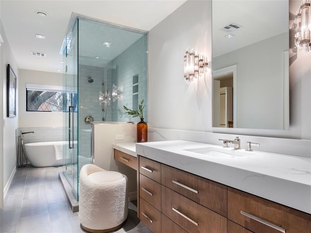 bathroom with tile patterned flooring, vanity, and shower with separate bathtub