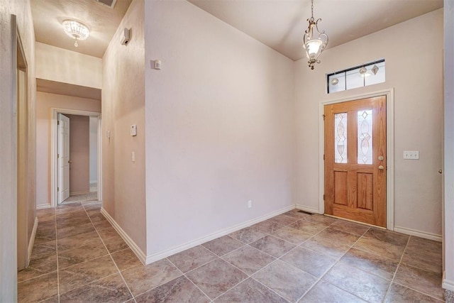 entryway with an inviting chandelier