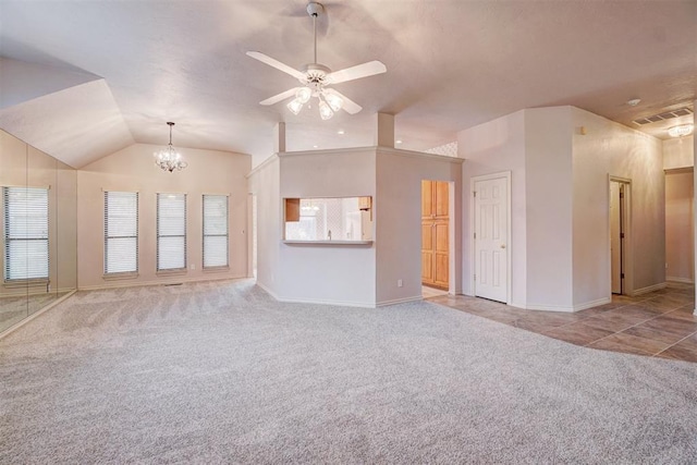 unfurnished living room with ceiling fan with notable chandelier, light colored carpet, and lofted ceiling