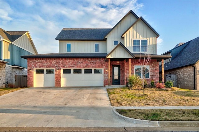 view of front of property featuring a front yard and a garage