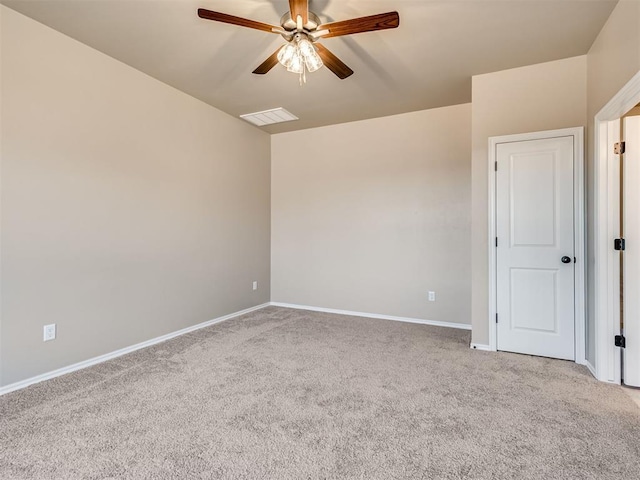 unfurnished room with light carpet, ceiling fan, visible vents, and baseboards