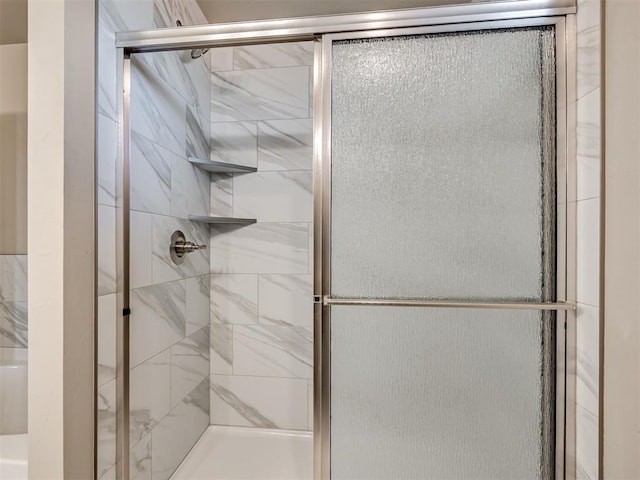 bathroom featuring a stall shower