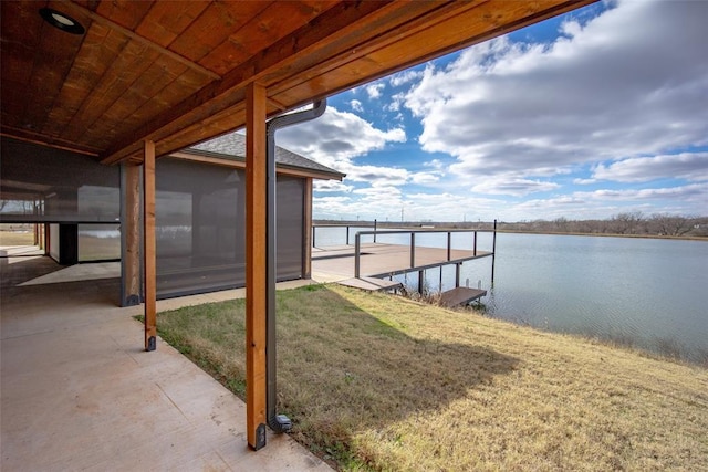 dock area featuring a water view and a yard