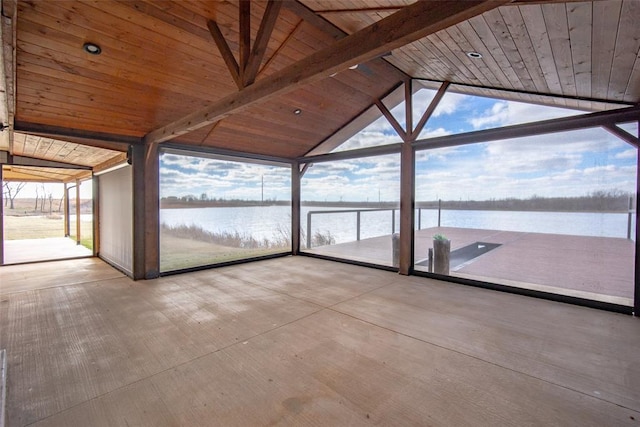 unfurnished sunroom with lofted ceiling with beams, a water view, and wooden ceiling