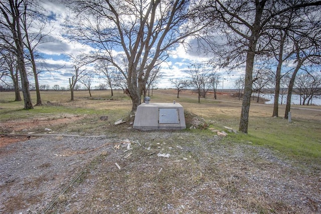 view of storm shelter with a water view