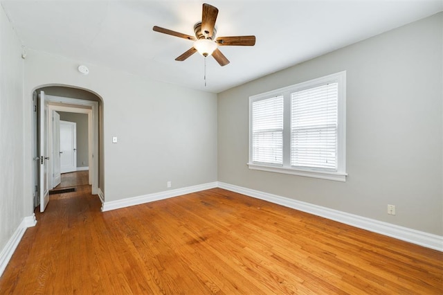 spare room featuring hardwood / wood-style floors and ceiling fan