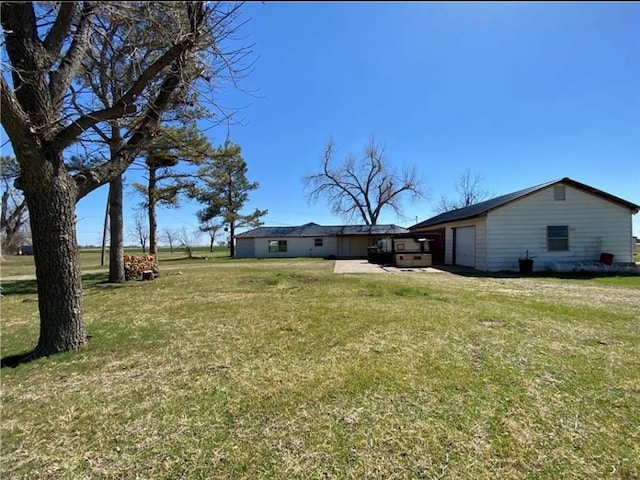 view of yard with a garage