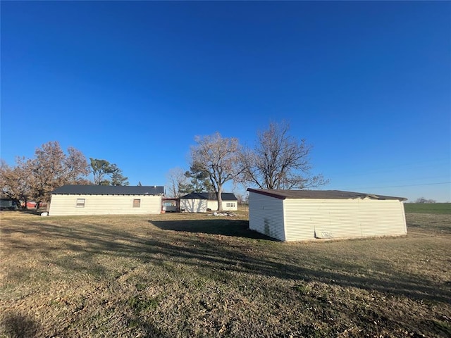 view of side of home featuring a yard