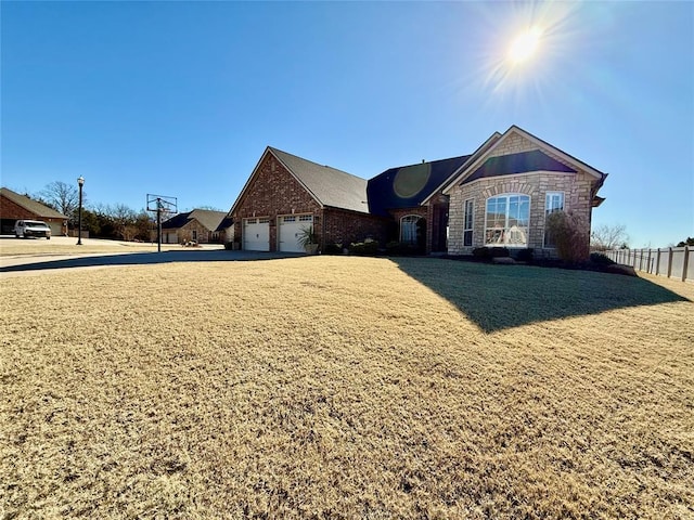 view of front facade featuring a garage and a front lawn