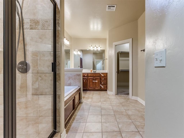 bathroom with vanity, separate shower and tub, and tile patterned flooring