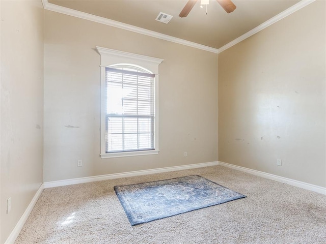 unfurnished room featuring ceiling fan and ornamental molding