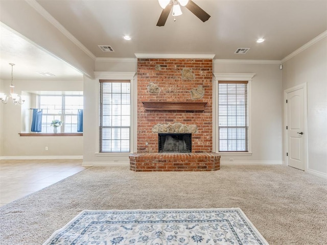 living room with crown molding, a brick fireplace, ceiling fan with notable chandelier, and light carpet