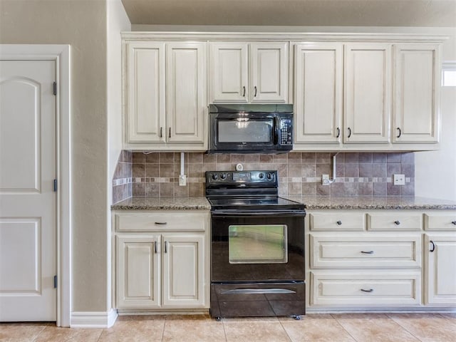 kitchen with white cabinetry, tasteful backsplash, light stone counters, black appliances, and light tile patterned flooring