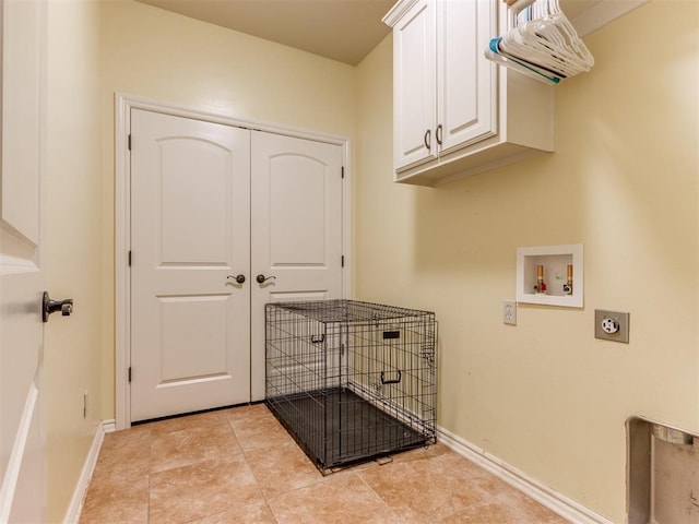 washroom with washer hookup, cabinets, and hookup for an electric dryer