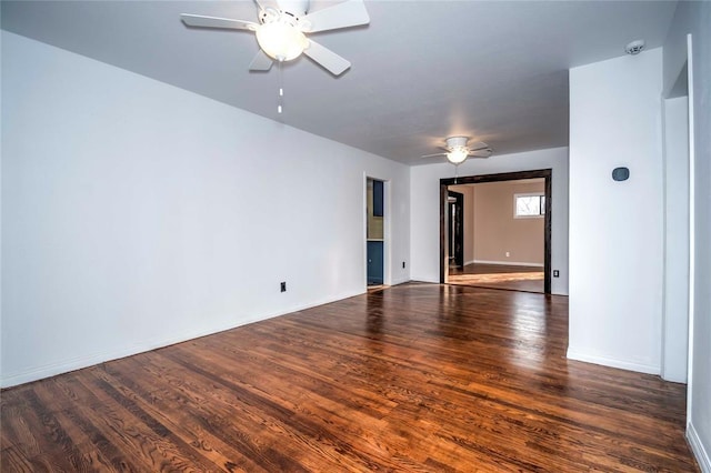 spare room featuring dark hardwood / wood-style floors and ceiling fan