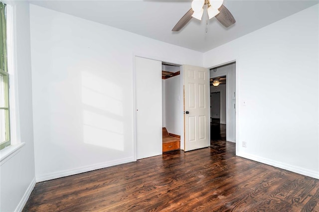 unfurnished bedroom with ceiling fan, a closet, and dark hardwood / wood-style floors