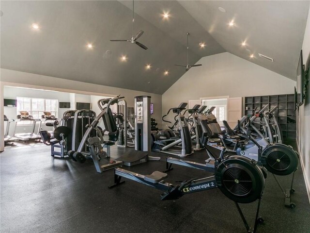 exercise room featuring ceiling fan and high vaulted ceiling