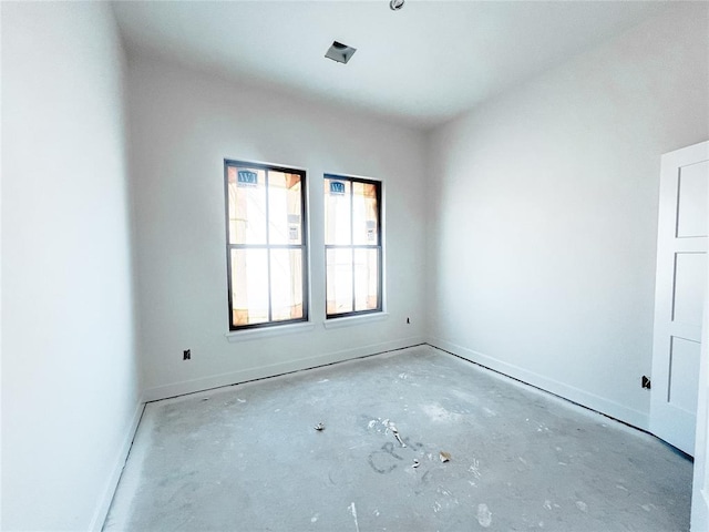 empty room featuring baseboards