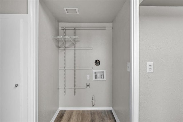 laundry area featuring hookup for a washing machine and hardwood / wood-style floors